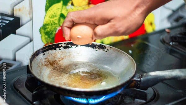 Obraz Cracking an Egg into a Pan