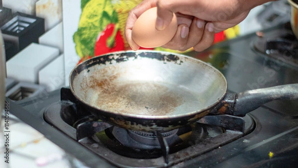 Obraz Cracking an Egg into a Pan