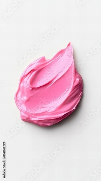 Fototapeta A smear of vibrant pink cream or paint on a white background. The texture is smooth and creamy, with visible brushstrokes.  The color is bold and eye-catching.