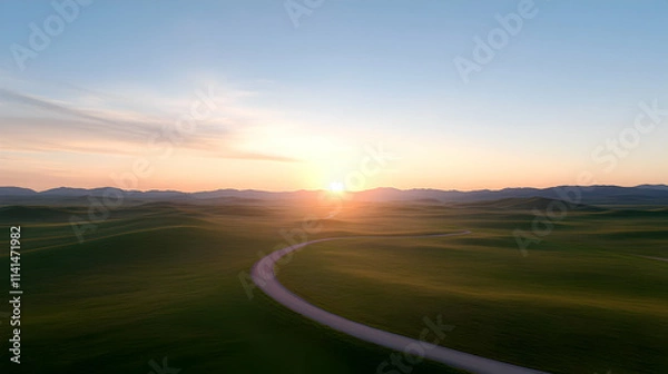 Obraz Serene landscape showcasing rolling hills under a vibrant sunrise sky.