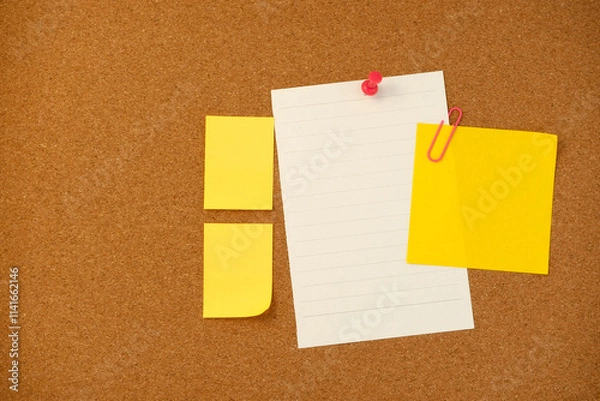 Fototapeta Blank sticky note paper on cork board wall. Noticeboard to organize life and work concept