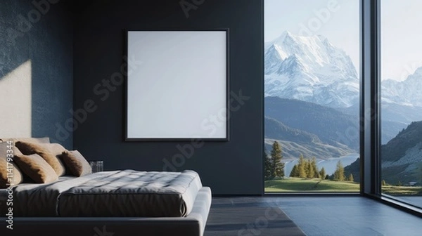 Fototapeta A  luxurious bedroom with a blank poster on a dark gray wall behind a modern upholstered bed. Large windows reveal a majestic mountain landscape.
