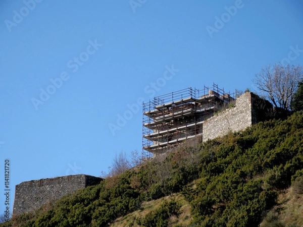 Fototapeta Historic fortifications of the city of Genoa, Italy. In the picture, the Fort Puin under renovation surrounded by scaffolding. 