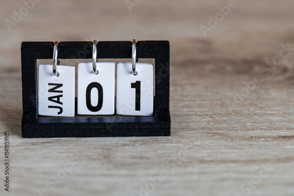 Fototapeta A perpetual desktop calendar on the desk. New Year. January 1st.
