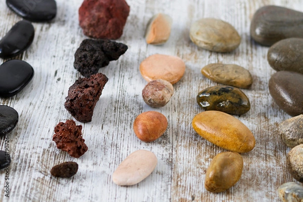 Fototapeta Collection of stones of different types on a gray background