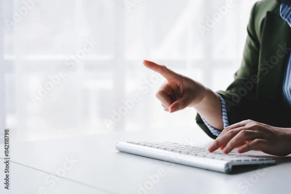 Fototapeta Typing on keyboard Working online on laptop computer On a white table at the office. Facebook chat. Web meeting. Blogger. Journalist writing an article. online job ideas