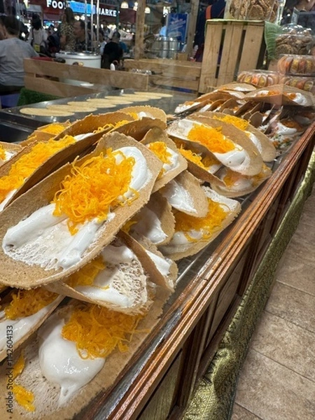 Obraz A large assortment of food items stacked together precariously on a table