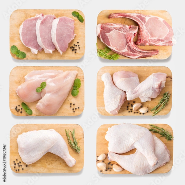 Fototapeta Mockup raw chicken and pork on cutting board set on  isolated 