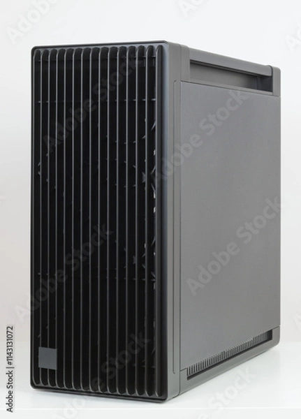 Fototapeta Side view of empty  big tower, PC case, chassis, 15.5 mm front panel grille with 45% porosity for maximum air intake. Studio shoot on white background.