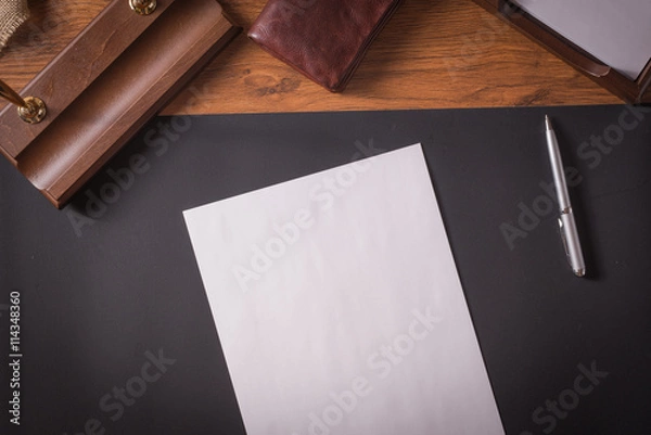 Fototapeta with paper with pen o a leather table