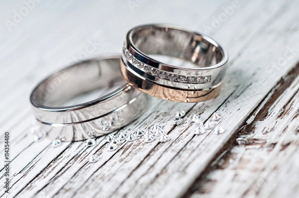 Fototapeta Wedding rings on rustic wood
