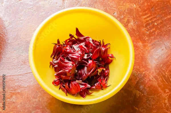 Fototapeta Sorrel Calyx In A yellow Bowl