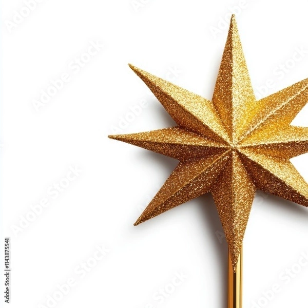 Fototapeta A shiny golden star wand, perfect for magical themes, celebrations, or costume accessories, radiates charm and elegance.
