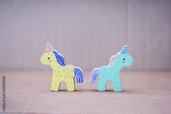 Obraz Wooden colorful unicorn horses