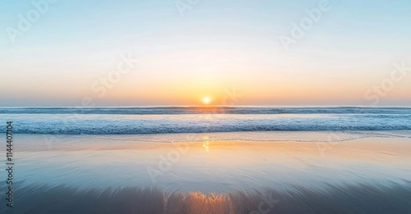 Fototapeta In the morning, the sea is illuminated by an orange sunrise as the sun sets.