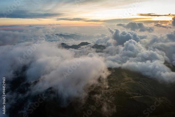 Fototapeta Over the Clouds along the slopes of a Volcano