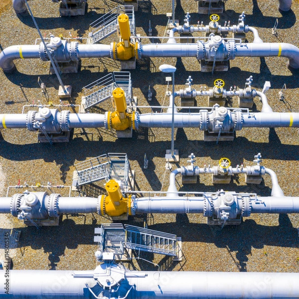 Fototapeta Natural gas pipeline in European Union. High pressure pipes on a hot summer day.
