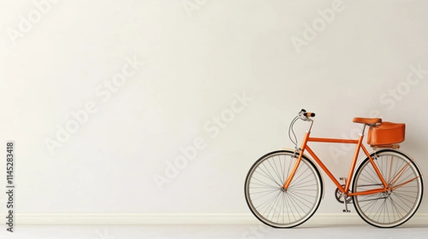 Fototapeta Bright orange bicycle parked against a minimalist white wall in a stylish indoor space