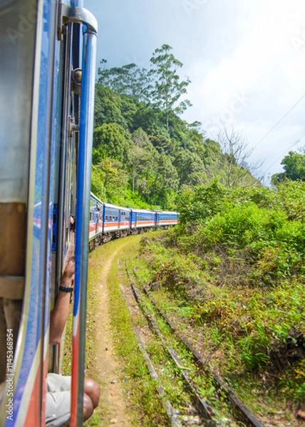 Fototapeta Colonial train route built by the British Empire, offering a journey through history, stunning mountains, waterfalls, and tea estates—Ella Odyssey train journey 2024.12.13 Ella Sri Lanka
