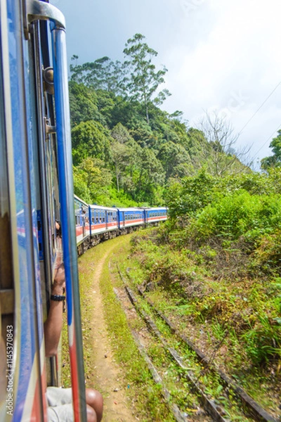 Fototapeta Colonial train route built by the British Empire, offering a journey through history, stunning mountains, waterfalls, and tea estates—Ella Odyssey train journey 2024.12.13 Ella Sri Lanka