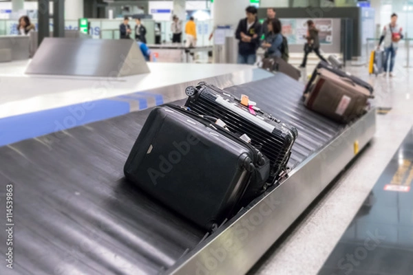 Fototapeta Luggage on the track blur background in airport