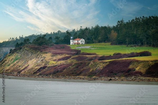 Fototapeta Admiralty Head Lighthouse located in Fort Casey State Park on Whidbey Island, in Island County, Washington. A 30-foot tall brick and stucco building designed by Carl Leick and completed in 1903.  