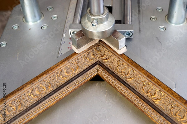 Obraz Craftsman working on frame in frameshop.