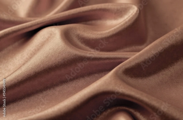 Fototapeta close-up of soft waves of silky fabric in trendy mocha mousse color
