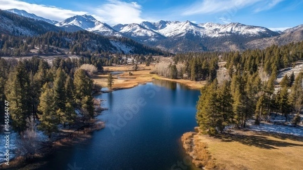 Fototapeta Aerial View of a Serene Alpine Lake Surrounded by Mountains