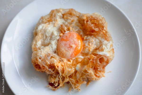 Obraz A plate of delicious fried egg makes a perfect and healthy lunch or dinner