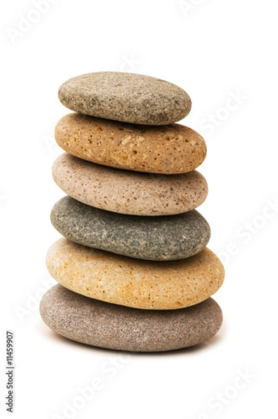 Fototapeta Stack of pebbles isolated on the white background