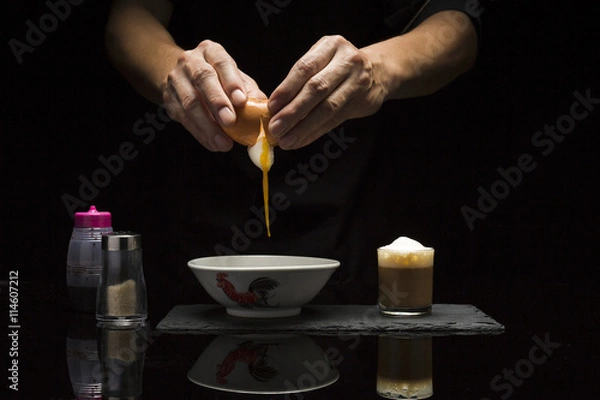Obraz Breaking an egg for breakfast