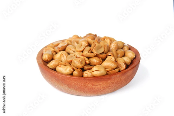 Fototapeta Roasted salted peanut on a wooden plate isolated on white background