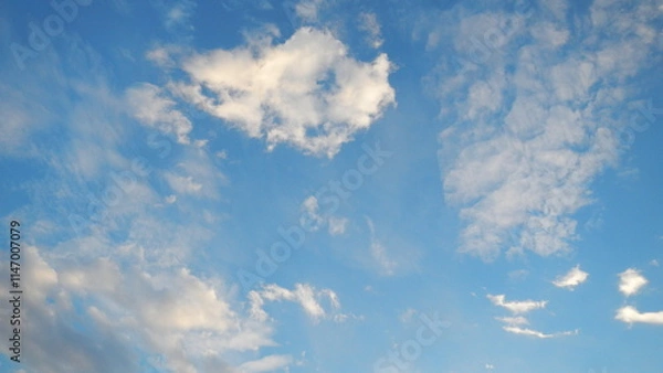 Obraz Blue sky and white Altocumulus clouds - weather background with natural patterns of clouds. Topics: air space, climate, atmosphere, meteorology, season, abstraction, nature, wallpaper