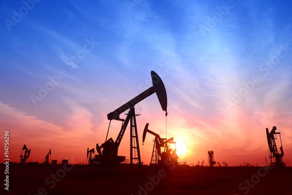 Obraz Is work of pumping unit, under the setting sun