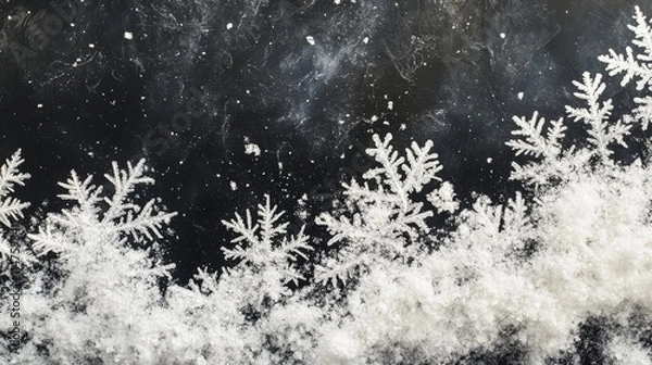 Fototapeta Snow Flakes Falling and Accumulating on Dark Surface
