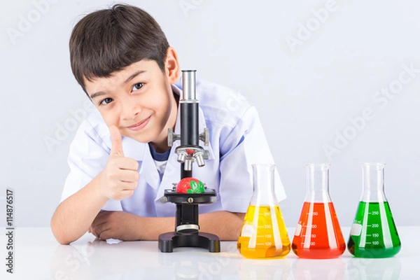 Obraz Little scientist boy with colorful flask