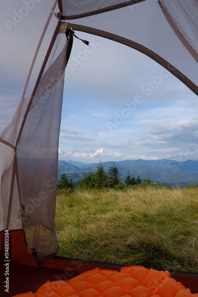 Fototapeta View of the mountain landscape from the tent.