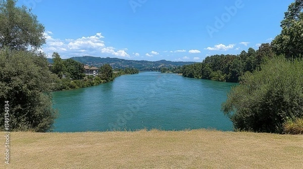 Fototapeta Panoramic view of the Areuse River winding through the NeuchÃ¢tel Jura in Switzerland, surrounded by lush green landscapes and serene nature, capturing the beauty of this tranquil setting.