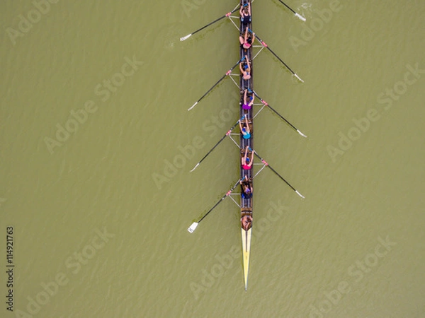 Obraz Eight rowing team boat aerial view