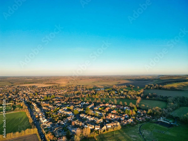 Fototapeta Aerial View of Barton Le Clay Village Countryside Landscape  Near Luton City of England UK. High Angle Footage Was Captured with Drone's Camera on November 29th, 2024 During Sunset Time.