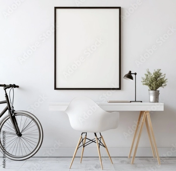 Fototapeta Minimalist home office with empty frame, bicycle, and desk.