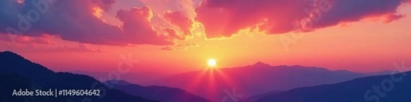 Fototapeta A majestic sunset over a mountain range with hues of orange and pink in the sky, evening sky, sunsets, sky