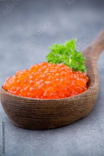 Obraz Salmon caviar with spoon on gray background.