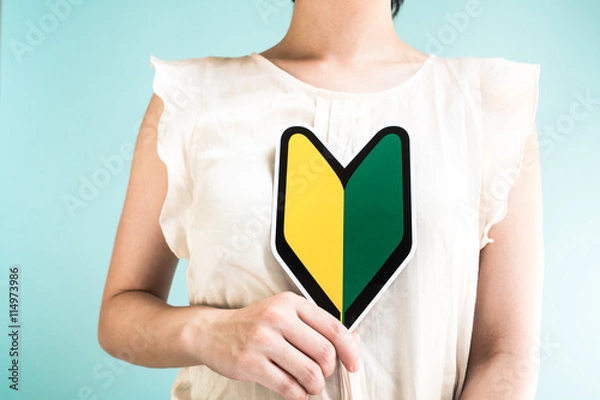 Obraz 初心者マークを持つ女性