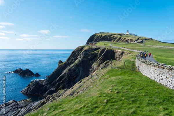 Fototapeta Picturesque coastal walk with cliffs, lighthouse, and panoramic ocean views