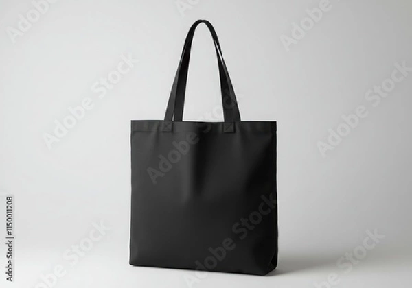 Fototapeta Black tote bag, simple design, canvas material, sturdy handles, minimalist aesthetic, eco