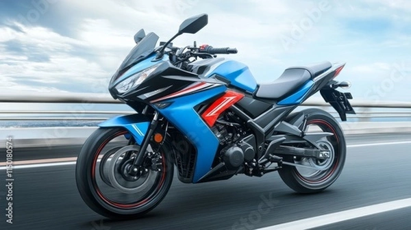 Fototapeta A blue motorcycle speeding on a road with a blurred background, showcasing its design and agility.