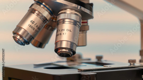 Fototapeta Microscope and test tubes in laboratory, Blue toned image