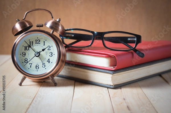 Obraz Retro alarm clock and book.